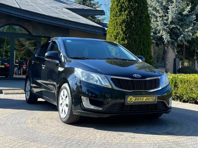 Черный Киа Рио, объемом двигателя 1.4 л и пробегом 215 тыс. км за 6999 $, фото 1 на Automoto.ua