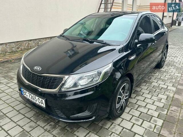 Чорний Кіа Ріо, об'ємом двигуна 1.4 л та пробігом 141 тис. км за 7200 $, фото 1 на Automoto.ua