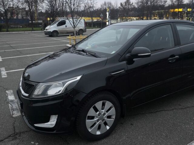 Черный Киа Рио, объемом двигателя 1.6 л и пробегом 150 тыс. км за 9000 $, фото 1 на Automoto.ua
