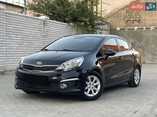 Чорний Кіа Ріо, об'ємом двигуна 1.4 л та пробігом 95 тис. км за 8999 $, фото 1 на Automoto.ua