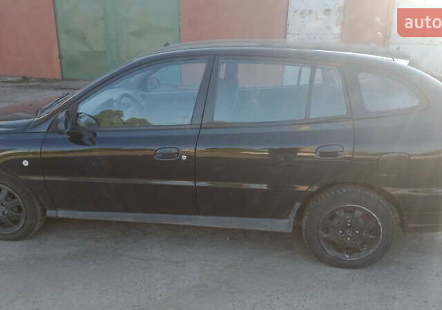 Черный Киа Рио, объемом двигателя 1.34 л и пробегом 230 тыс. км за 3400 $, фото 1 на Automoto.ua