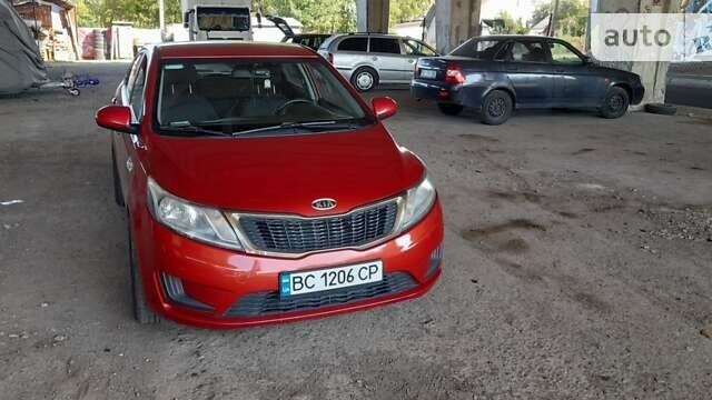 Красный Киа Рио, объемом двигателя 1.4 л и пробегом 319 тыс. км за 6000 $, фото 1 на Automoto.ua