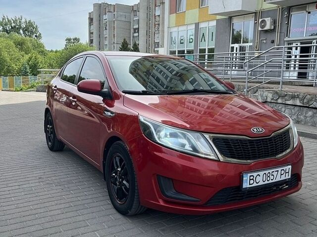 Червоний Кіа Ріо, об'ємом двигуна 1.4 л та пробігом 220 тис. км за 5500 $, фото 1 на Automoto.ua