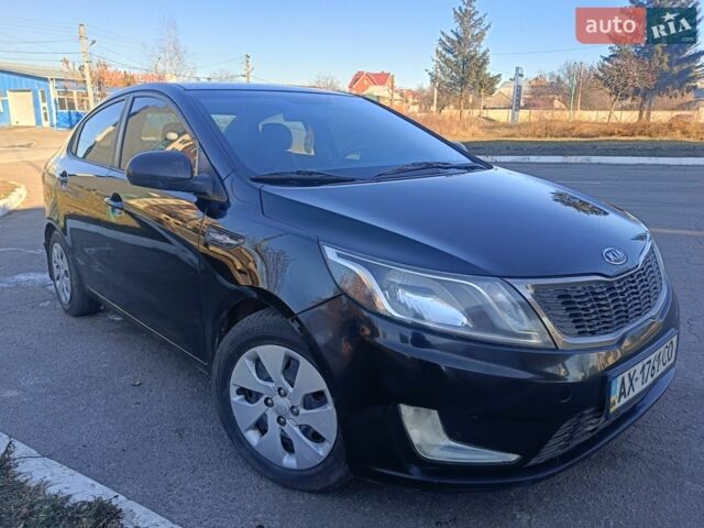 Красный Киа Рио, объемом двигателя 1.4 л и пробегом 232 тыс. км за 5300 $, фото 1 на Automoto.ua