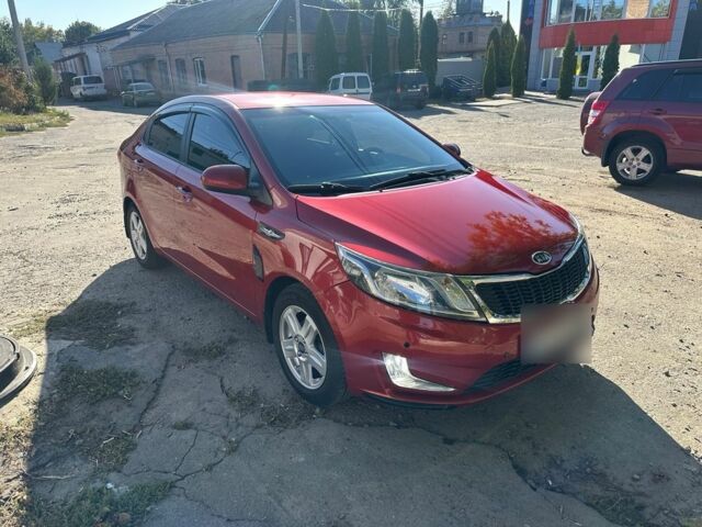 Красный Киа Рио, объемом двигателя 1.6 л и пробегом 169 тыс. км за 7799 $, фото 1 на Automoto.ua