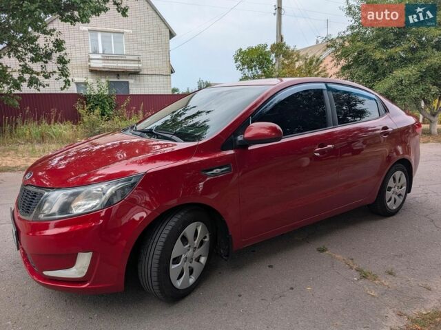 Красный Киа Рио, объемом двигателя 1.4 л и пробегом 181 тыс. км за 6800 $, фото 1 на Automoto.ua