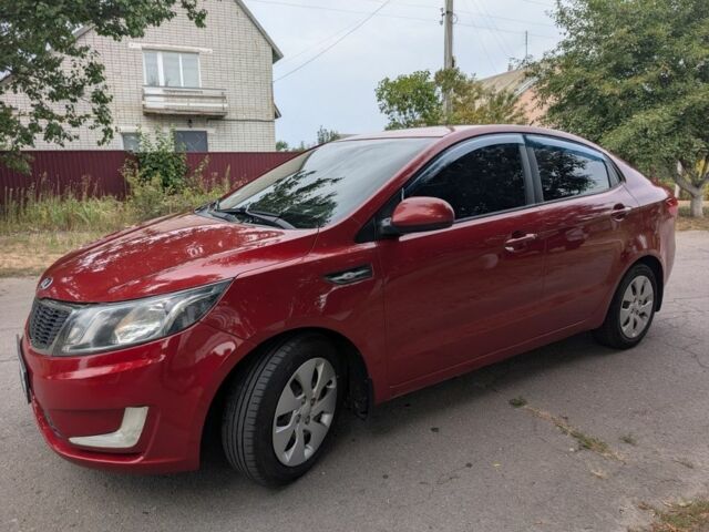 Червоний Кіа Ріо, об'ємом двигуна 1.4 л та пробігом 181 тис. км за 6837 $, фото 1 на Automoto.ua