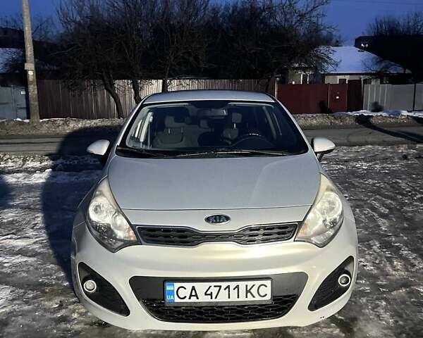Серый Киа Рио, объемом двигателя 1.12 л и пробегом 220 тыс. км за 5750 $, фото 1 на Automoto.ua