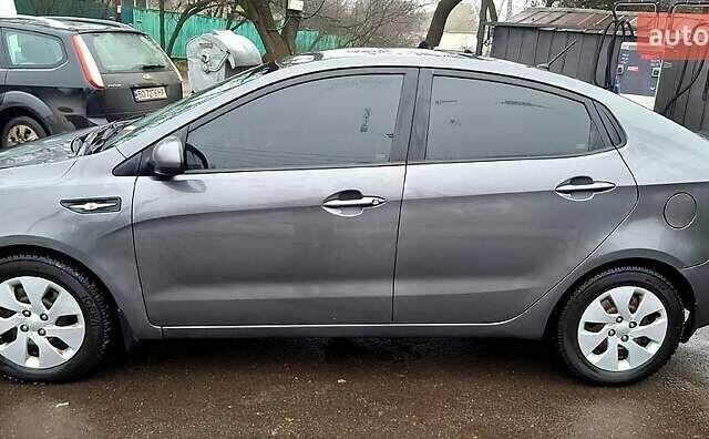 Сірий Кіа Ріо, об'ємом двигуна 1.4 л та пробігом 243 тис. км за 5700 $, фото 1 на Automoto.ua