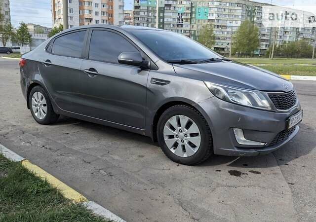 Серый Киа Рио, объемом двигателя 1.59 л и пробегом 250 тыс. км за 6990 $, фото 1 на Automoto.ua