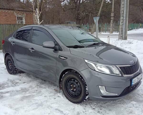 Серый Киа Рио, объемом двигателя 1.4 л и пробегом 100 тыс. км за 7700 $, фото 1 на Automoto.ua