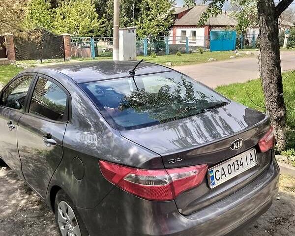 Сірий Кіа Ріо, об'ємом двигуна 1.4 л та пробігом 205 тис. км за 6950 $, фото 1 на Automoto.ua