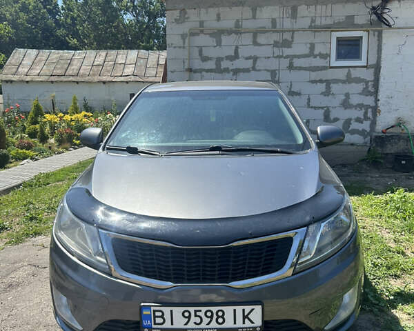 Серый Киа Рио, объемом двигателя 1.6 л и пробегом 250 тыс. км за 8299 $, фото 1 на Automoto.ua