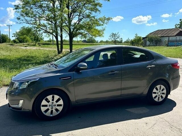 Серый Киа Рио, объемом двигателя 1.59 л и пробегом 140 тыс. км за 6600 $, фото 1 на Automoto.ua