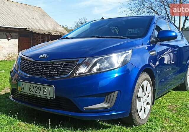 Синій Кіа Ріо, об'ємом двигуна 1.4 л та пробігом 175 тис. км за 7600 $, фото 1 на Automoto.ua