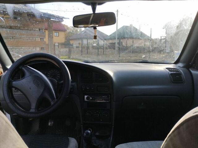 Белый Киа Сефия, объемом двигателя 1.5 л и пробегом 200 тыс. км за 1400 $, фото 1 на Automoto.ua