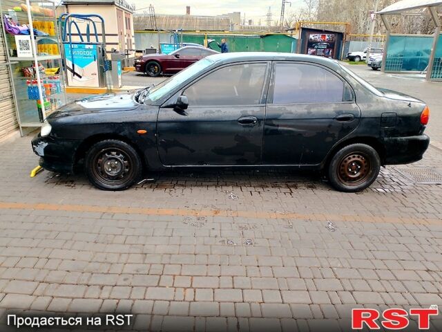 Чорний Кіа Сефія, об'ємом двигуна 1.5 л та пробігом 265 тис. км за 850 $, фото 1 на Automoto.ua