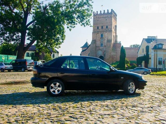 Чорний Кіа Сефія, об'ємом двигуна 1.6 л та пробігом 340 тис. км за 2800 $, фото 1 на Automoto.ua