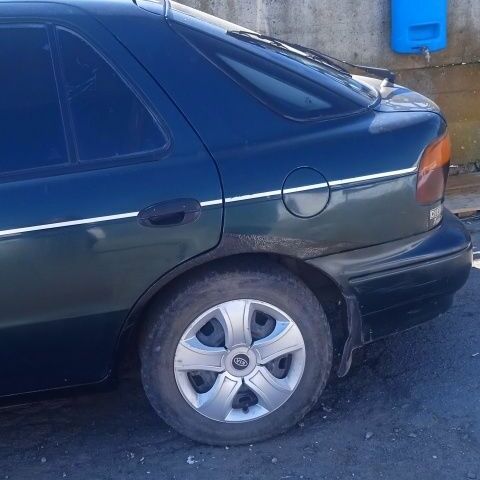 Зелений Кіа Сефія, об'ємом двигуна 1 л та пробігом 2 тис. км за 1100 $, фото 1 на Automoto.ua