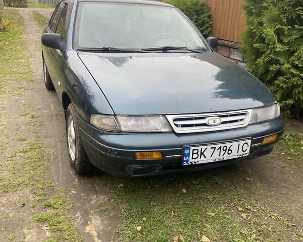 Зеленый Киа Сефия, объемом двигателя 1.6 л и пробегом 320 тыс. км за 870 $, фото 1 на Automoto.ua