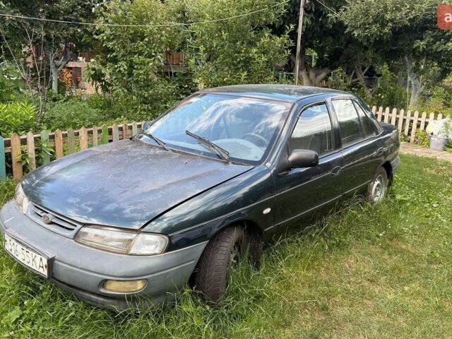 Зеленый Киа Сефия, объемом двигателя 1.6 л и пробегом 424 тыс. км за 700 $, фото 1 на Automoto.ua