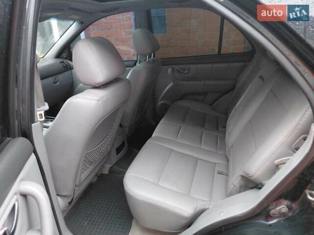 Черный Киа Соренто, объемом двигателя 2.5 л и пробегом 250 тыс. км за 6500 $, фото 1 на Automoto.ua