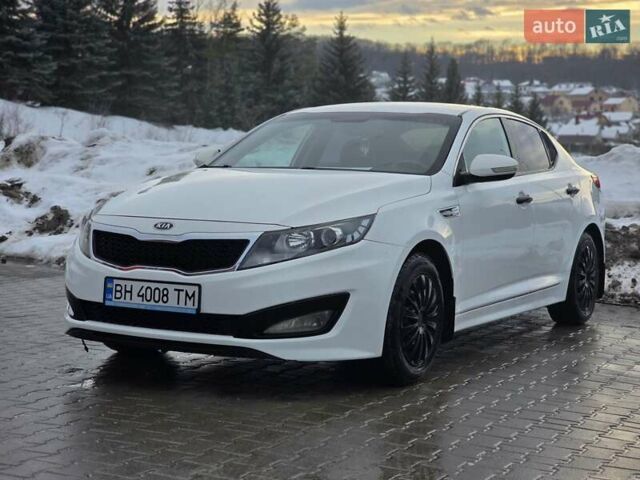 Белый Киа K5, объемом двигателя 2 л и пробегом 439 тыс. км за 6999 $, фото 1 на Automoto.ua