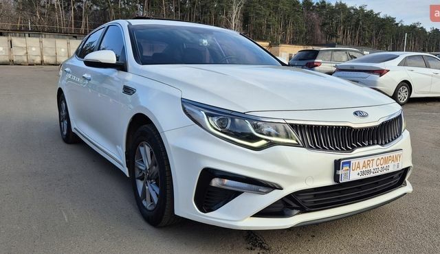 Белый Киа K5, объемом двигателя 2 л и пробегом 144 тыс. км за 14400 $, фото 1 на Automoto.ua