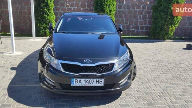 Черный Киа K5, объемом двигателя 2 л и пробегом 260 тыс. км за 9600 $, фото 1 на Automoto.ua