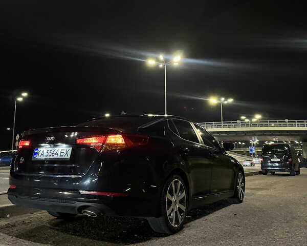 Черный Киа K5, объемом двигателя 2 л и пробегом 284 тыс. км за 9450 $, фото 1 на Automoto.ua