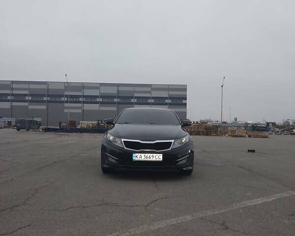 Черный Киа K5, объемом двигателя 2 л и пробегом 281 тыс. км за 11200 $, фото 1 на Automoto.ua
