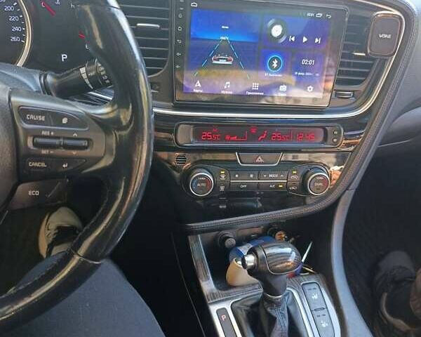 Черный Киа K5, объемом двигателя 2 л и пробегом 131 тыс. км за 12000 $, фото 1 на Automoto.ua