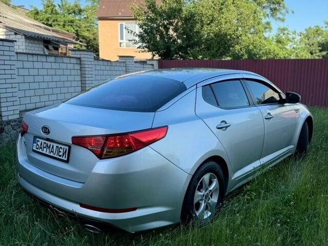 Серый Киа K5, объемом двигателя 2 л и пробегом 230 тыс. км за 7500 $, фото 1 на Automoto.ua
