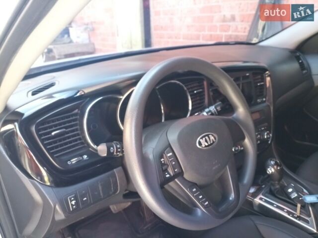Серый Киа K5, объемом двигателя 2 л и пробегом 220 тыс. км за 9500 $, фото 1 на Automoto.ua