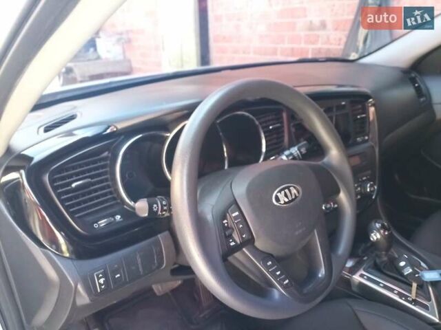 Серый Киа K5, объемом двигателя 2 л и пробегом 220 тыс. км за 9500 $, фото 1 на Automoto.ua