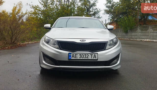 Серый Киа K5, объемом двигателя 2 л и пробегом 190 тыс. км за 9500 $, фото 1 на Automoto.ua