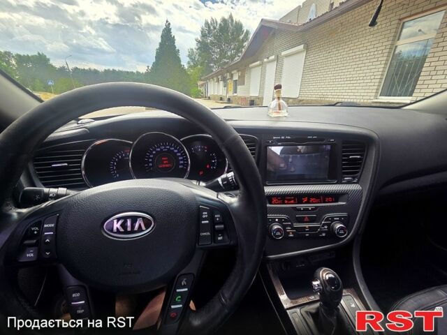 Серый Киа K5, объемом двигателя 2 л и пробегом 232 тыс. км за 10500 $, фото 1 на Automoto.ua