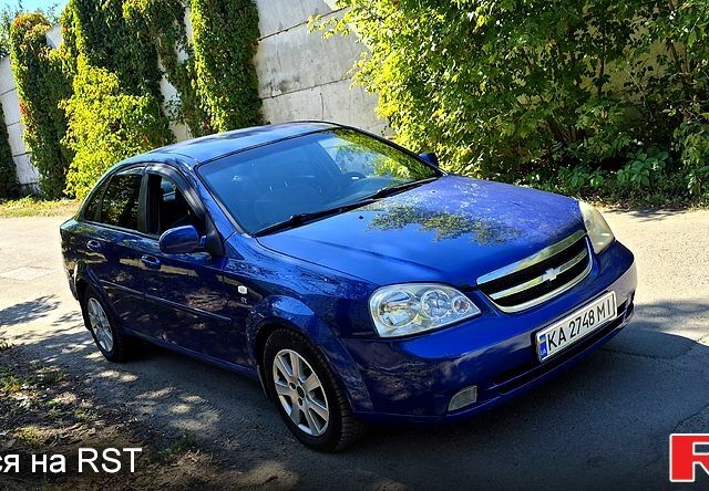 Серый Киа K5, объемом двигателя 2 л и пробегом 200 тыс. км за 8500 $, фото 1 на Automoto.ua