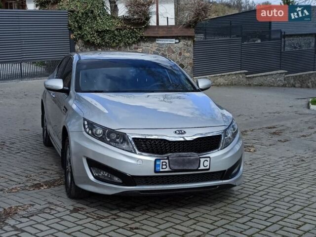 Серый Киа K5, объемом двигателя 2 л и пробегом 211 тыс. км за 8100 $, фото 1 на Automoto.ua