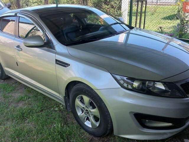 Серый Киа K5, объемом двигателя 2 л и пробегом 298 тыс. км за 7300 $, фото 1 на Automoto.ua