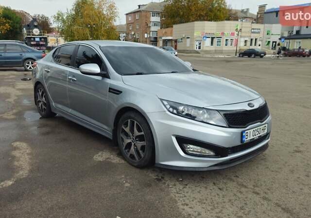 Серый Киа K5, объемом двигателя 2 л и пробегом 249 тыс. км за 8700 $, фото 1 на Automoto.ua
