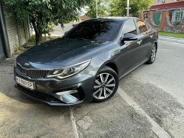 Серый Киа K5, объемом двигателя 2 л и пробегом 333 тыс. км за 14500 $, фото 1 на Automoto.ua
