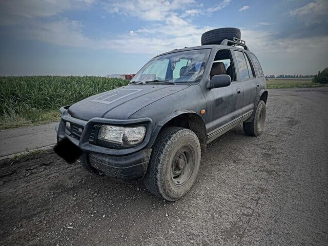 Черный Киа Sportage, объемом двигателя 2 л и пробегом 240 тыс. км за 2000 $, фото 1 на Automoto.ua