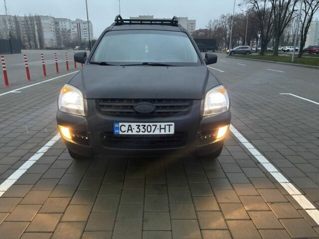Черный Киа Sportage, объемом двигателя 2 л и пробегом 322 тыс. км за 7000 $, фото 1 на Automoto.ua