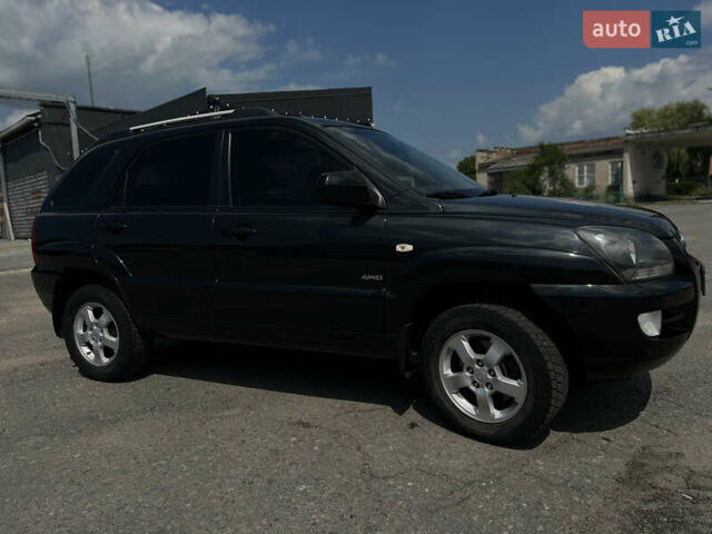 Черный Киа Sportage, объемом двигателя 2 л и пробегом 150 тыс. км за 10000 $, фото 1 на Automoto.ua