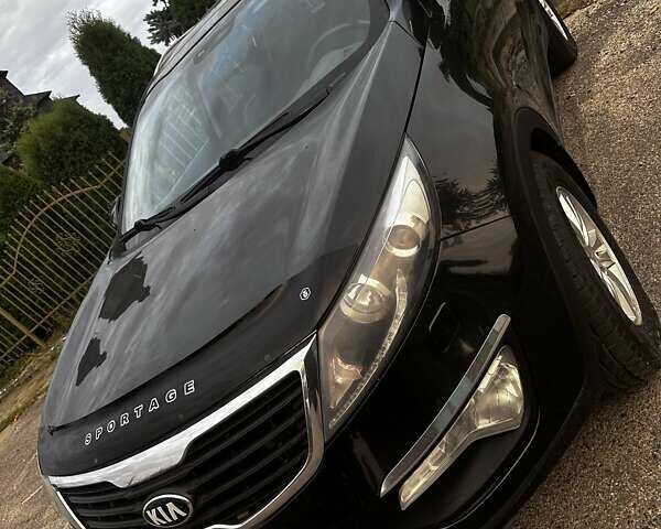 Черный Киа Sportage, объемом двигателя 1.7 л и пробегом 214 тыс. км за 12000 $, фото 1 на Automoto.ua