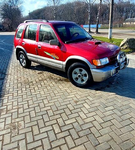 Красный Киа Sportage, объемом двигателя 2 л и пробегом 370 тыс. км за 3500 $, фото 1 на Automoto.ua