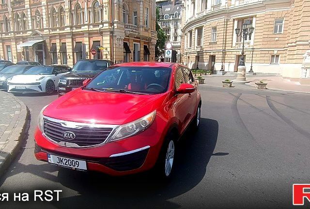 Красный Киа Sportage, объемом двигателя 2.4 л и пробегом 300 тыс. км за 10500 $, фото 1 на Automoto.ua