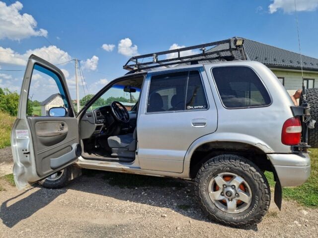 Серый Киа Sportage, объемом двигателя 2 л и пробегом 300 тыс. км за 4500 $, фото 1 на Automoto.ua