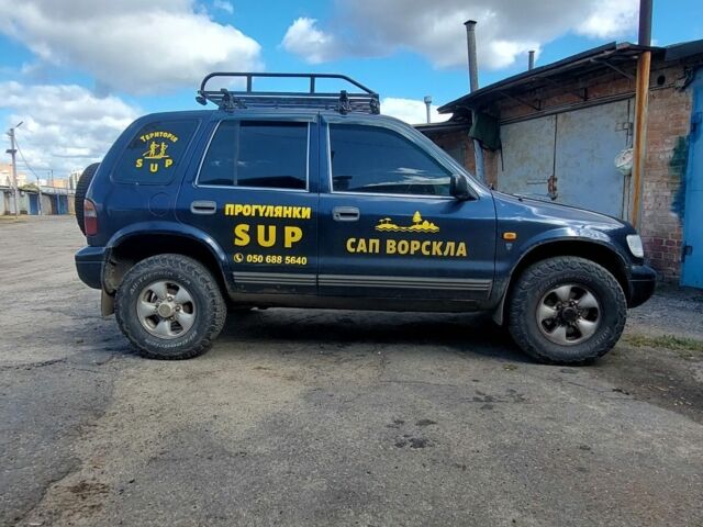 Синий Киа Sportage, объемом двигателя 2 л и пробегом 400 тыс. км за 4000 $, фото 1 на Automoto.ua